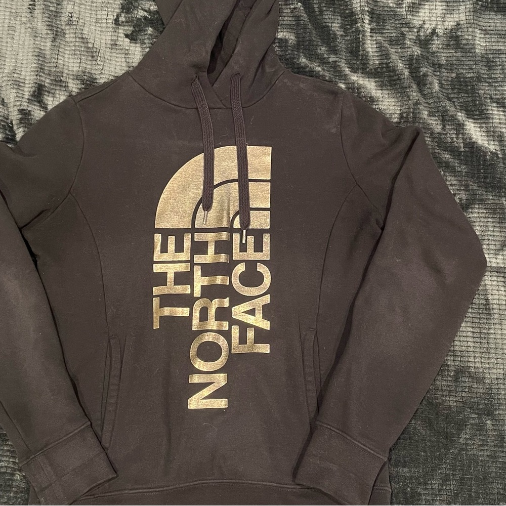 The North Face Black Hoodie with Gold Logo